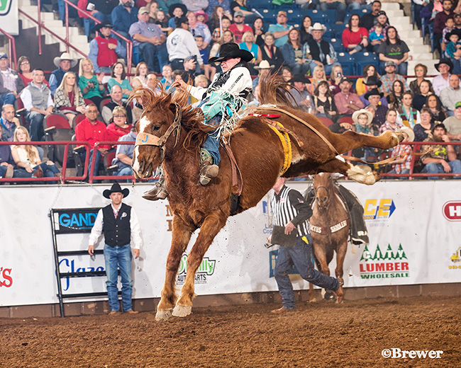 Tanner Aus rides J Bar J’s Pass The Hat for 90 points to take the lead at the San Angelo Stock Show and Rodeo. It was the first time Aus has ridden for that score in his ProRodeo career. (PHOTO BY TODD BREWER)