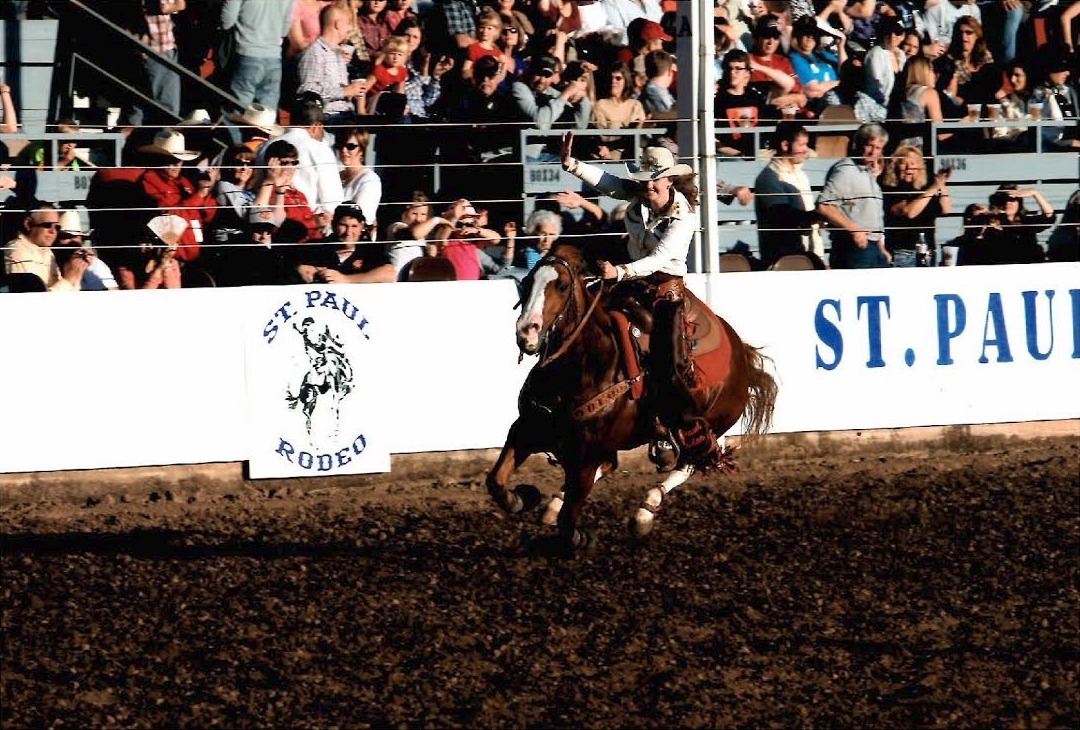 The horse race at the St. Paul Rodeo, circa 1948. Sam Smith, third generation volunteer, is on the outside (far left); Phil Kirk is next, with Dick Smith and an unidentified boy on the right. The race master put Sam in the outside position because he had won the last several races, so somebody else would have a chance to win it.