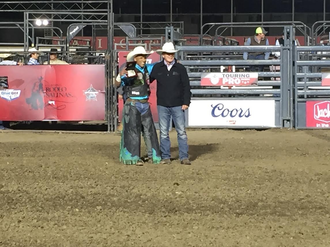 Photo: Rodeo President Mike Scarr presents Wallace Vieira de Oliveira with his championship buckle. A professional photo will be available on Thursday.
