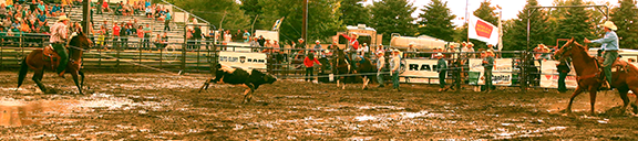 Team ropers Garrett Tonozzi and Wyatt Cox didn’t let the mud keep them from taking the team roping lead with 4.9 seconds at Mandan Rodeo Days. ’Photo by Jackie Jensen