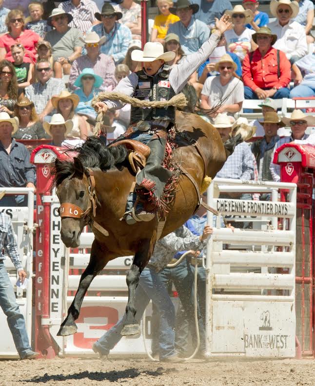Canadian Zeke Thurston moved to the lead in the first round of saddle bronc riding at the 120th annual Cheyenne Frontier Days Rodeo with an 84-point ride on Hi Lo Pro Rodeo’s LuLu. -- CFD photo by Dan Hubbell.