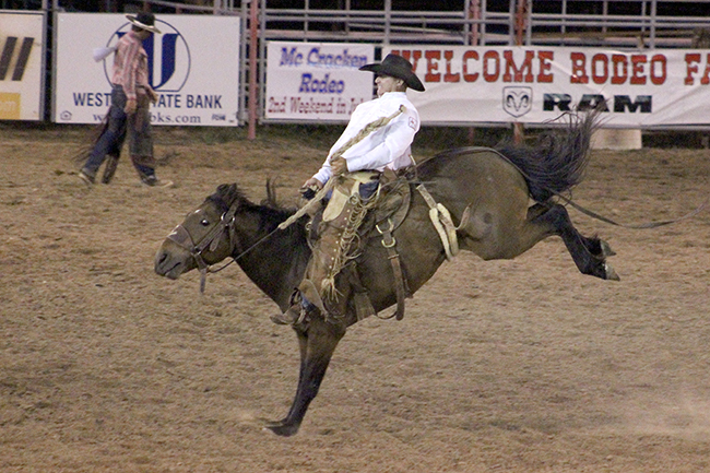 Reid Green competes in ranch bronc riding during Friday’s first go-round of the Kansas Professional Rodeo Association Finals. Green scored 74 points to win the opening round and move closer to the KPRA title.