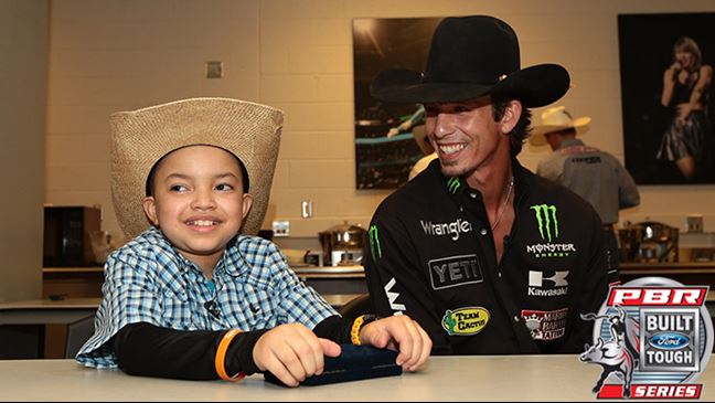 J.B. Mauney gave young Joseph Sanford the surprise of the weekend by hanging out and sharing stories in Charlotte. Photo: Andy Watson / BullStockMedia.com