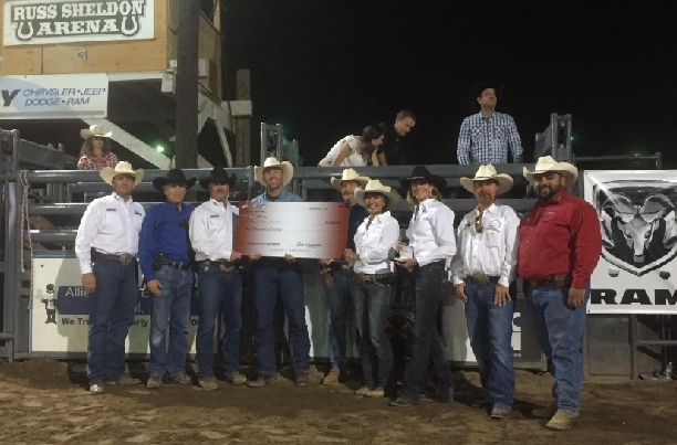Nick LaDuke receives his check and buckle from members of the San Dimas, Norco, Poway, and Sheriff’s Rodeo committees